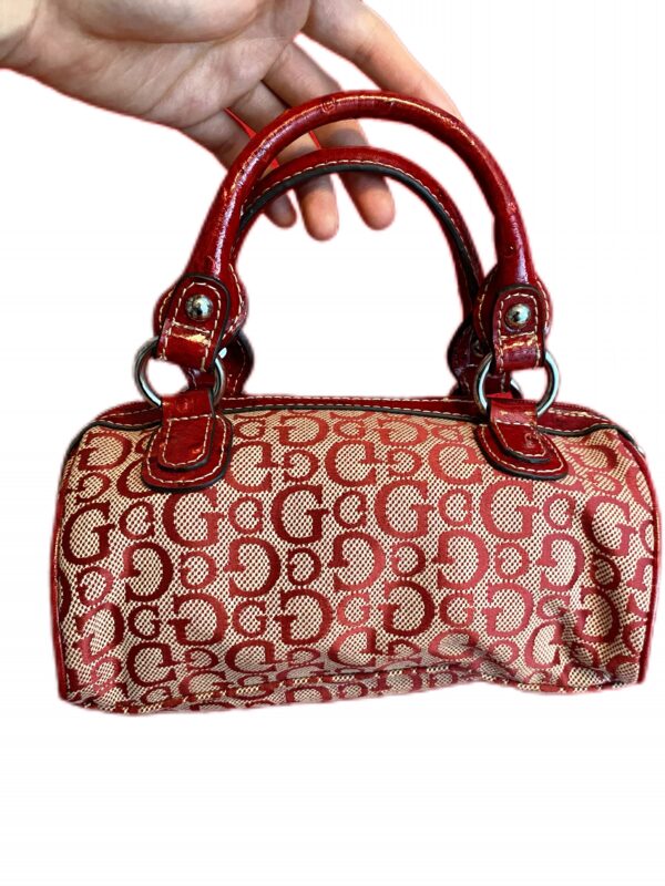 A charming mini hand bag from Guess in a striking red - Image 3